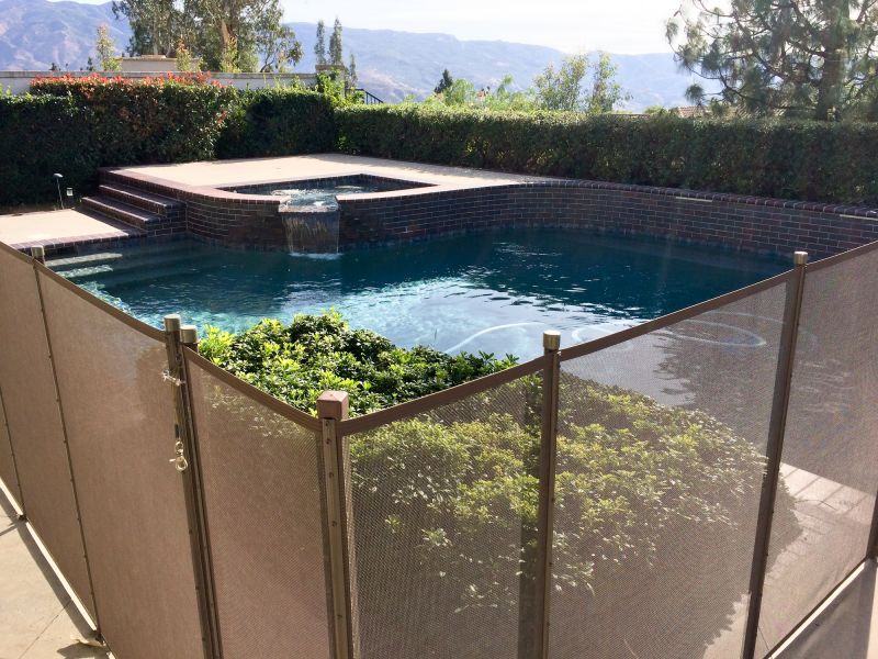 Mesh Fence Secured at Pool Edge